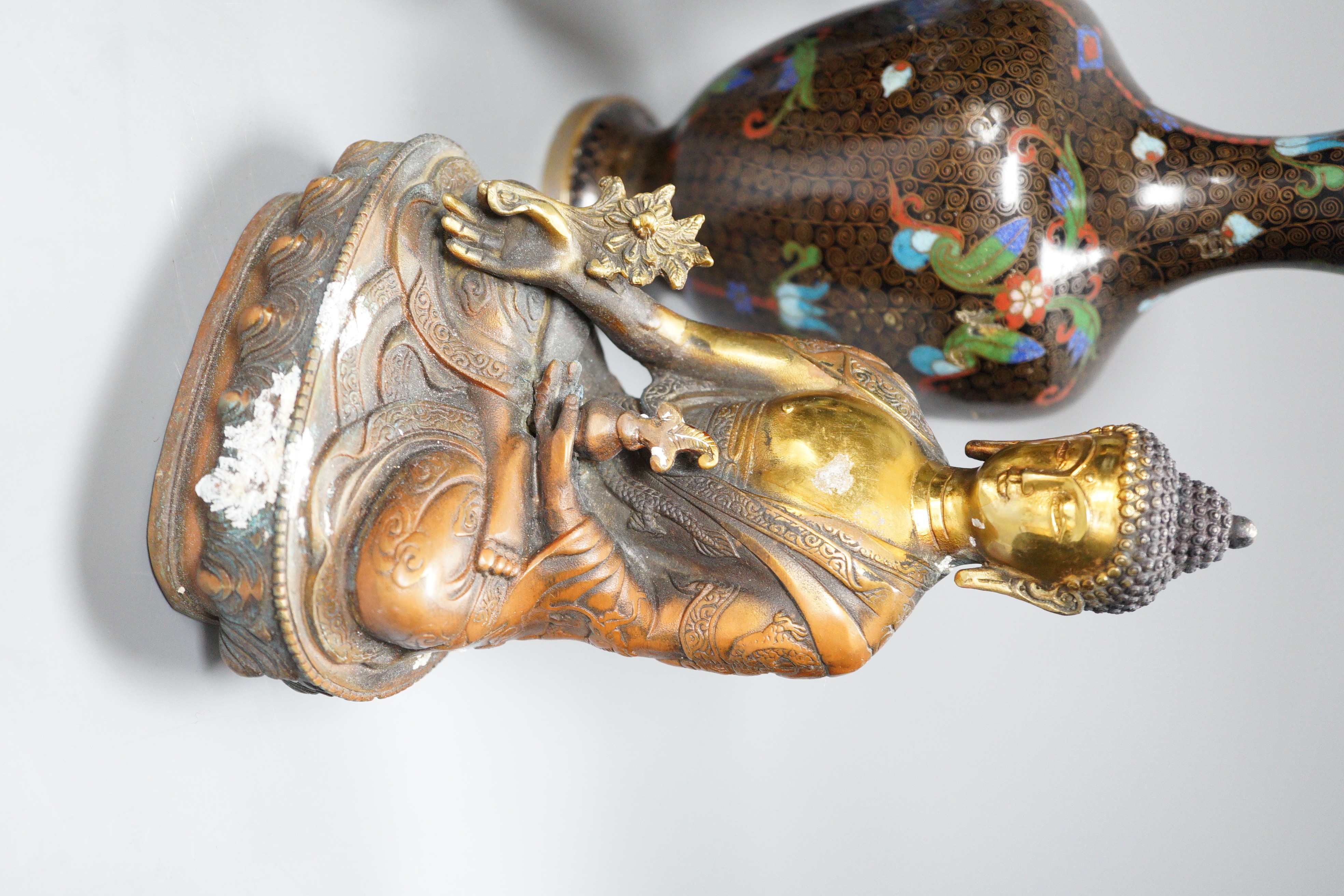A Himalayan bronze Buddha and a group of Chinese cloisonné vases